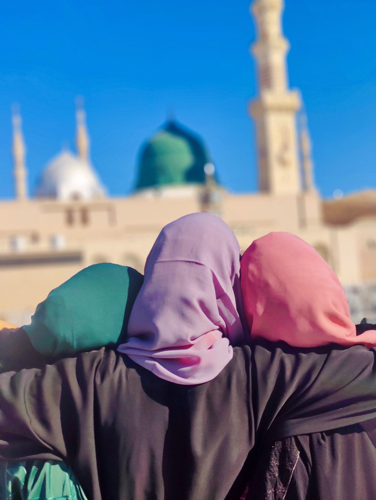 Sisters together before the Green Dome of Masjid an-Nabawi